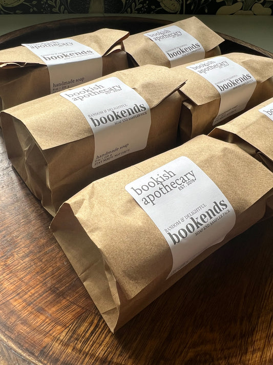 Kraft paper bags with labels on a wooden surface