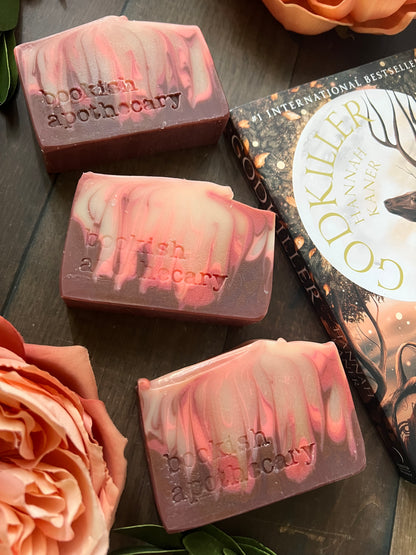 bars of soap with 'bookish apothecary' branding on a dark surface