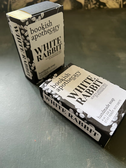Two soap bars with 'White Rabbit' branding on a gray surface