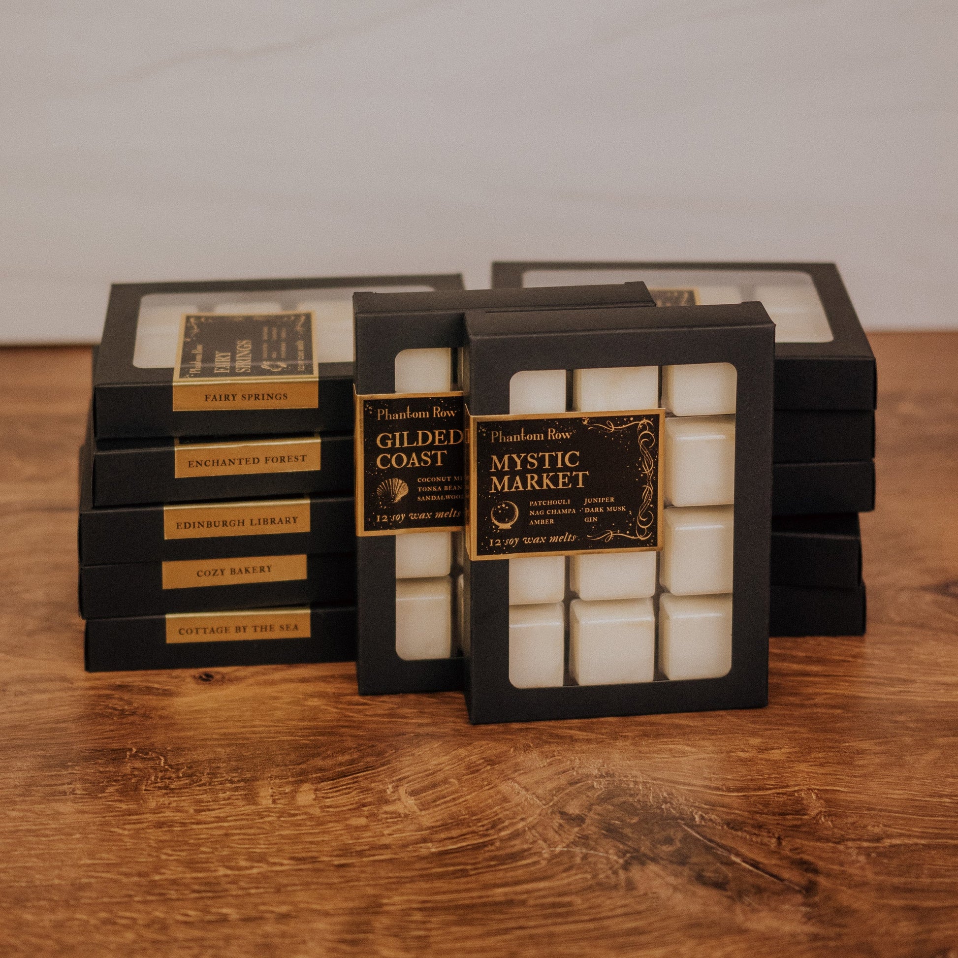 Packaged wax melts with labels on a wooden surface