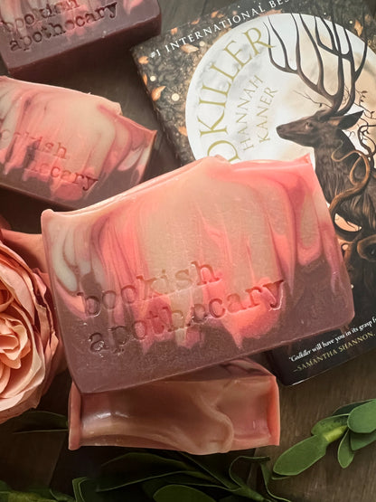 bars of soap with 'bookish apothecary' branding on a dark surface