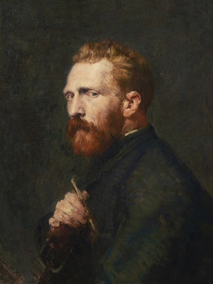 Portrait of a man with a red beard holding a paintbrush against a dark background